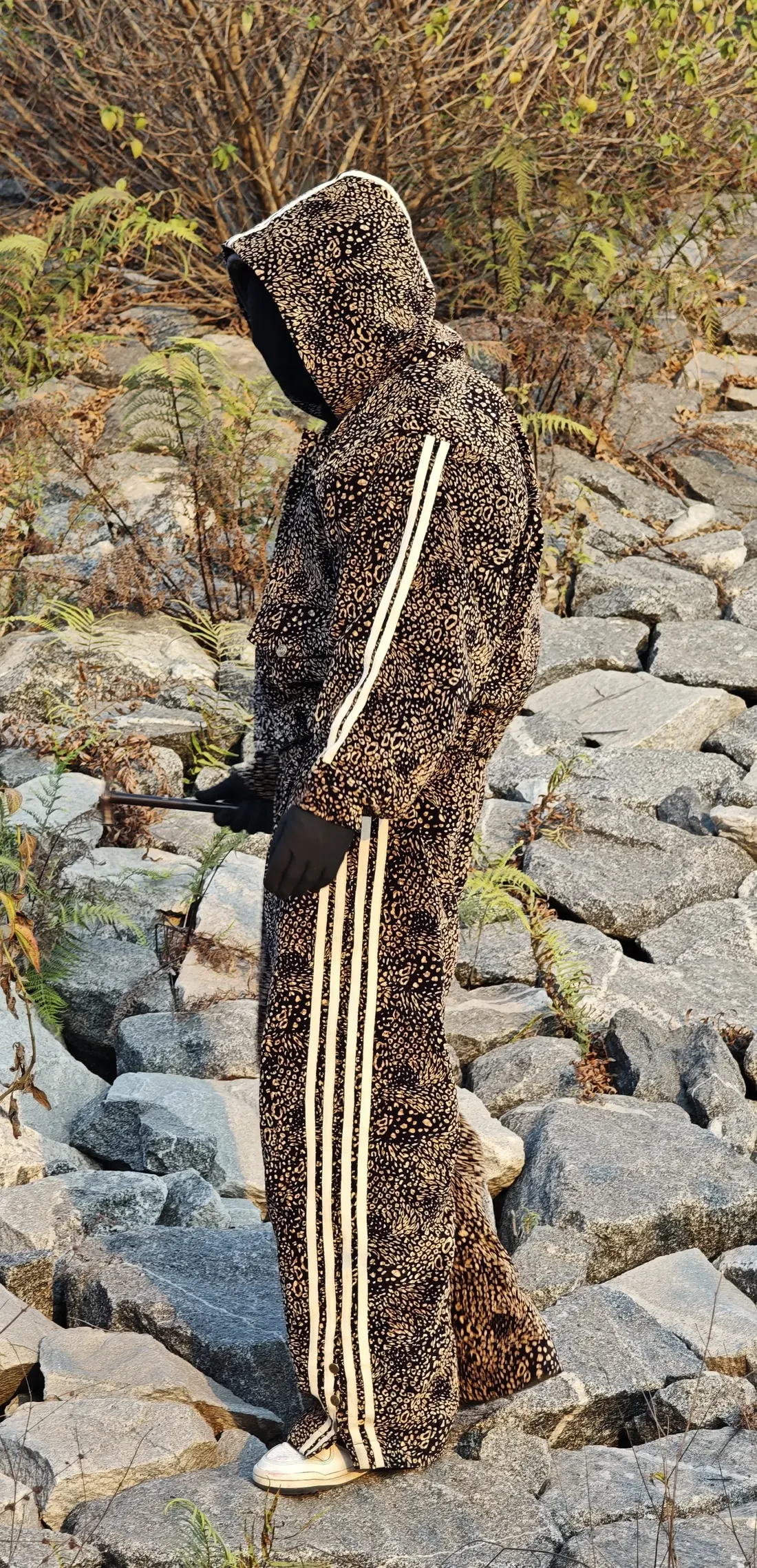 Model wearing the full Roar leopard set on rocks